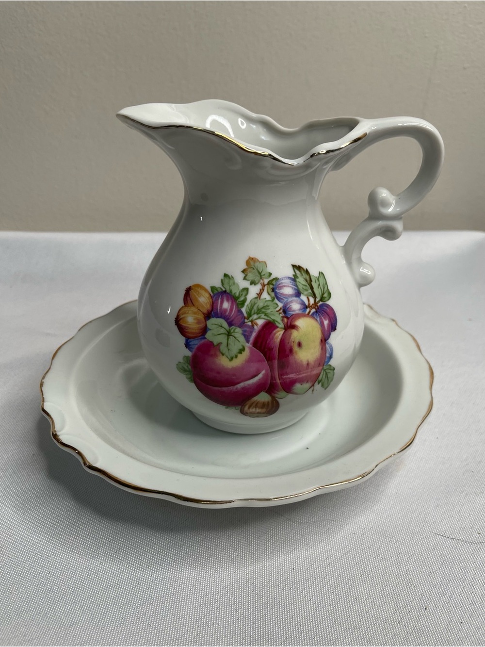 Vin porcelain pitcher and underplate set, fruit pattern gold trim, Japan, 3/4